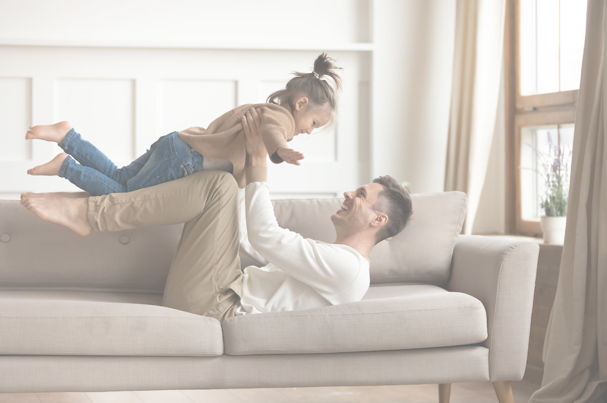 father and daughter on couch